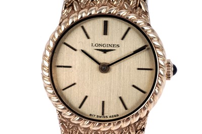 Lot 419 - Longines: an 18ct yellow gold lady's manual wind cocktail watch