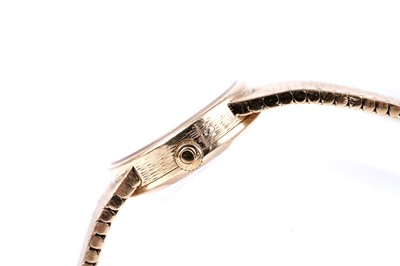 Lot 413 - Omega: a lady's 18ct yellow gold cased manual wind cocktail watch