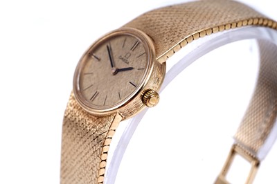 Lot 413 - Omega: a lady's 18ct yellow gold cased manual wind cocktail watch