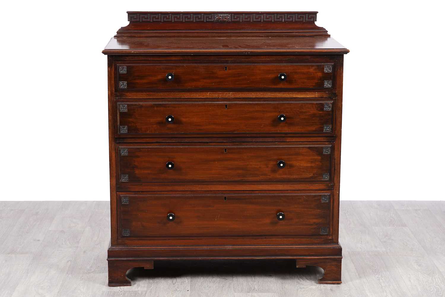 Lot 97 - An Edwardian mahogany chest of four long drawers