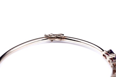 Lot 2 - A modern amethyst hinged bangle