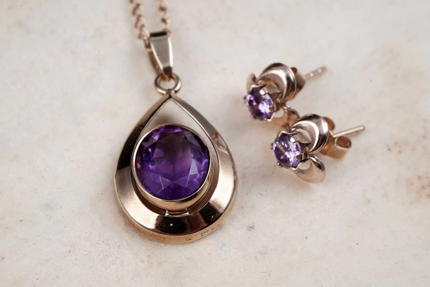 Lot 14 - A modern amethyst pendant necklace; and a pair of stud earrings