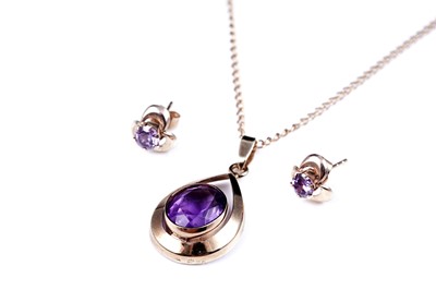 Lot 14 - A modern amethyst pendant necklace; and a pair of stud earrings