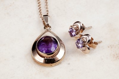 Lot 14 - A modern amethyst pendant necklace; and a pair of stud earrings