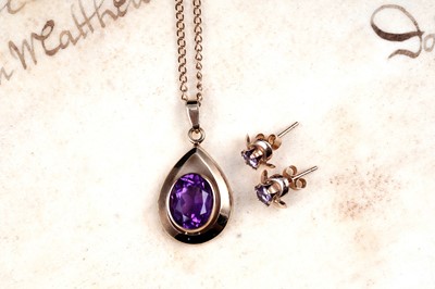 Lot 14 - A modern amethyst pendant necklace; and a pair of stud earrings