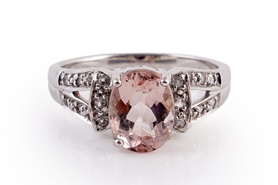 Lot 434 - A morganite and white spinel ring