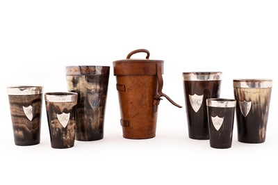 Lot 67 - A late Victorian nest of six silver mounted cow horn beakers
