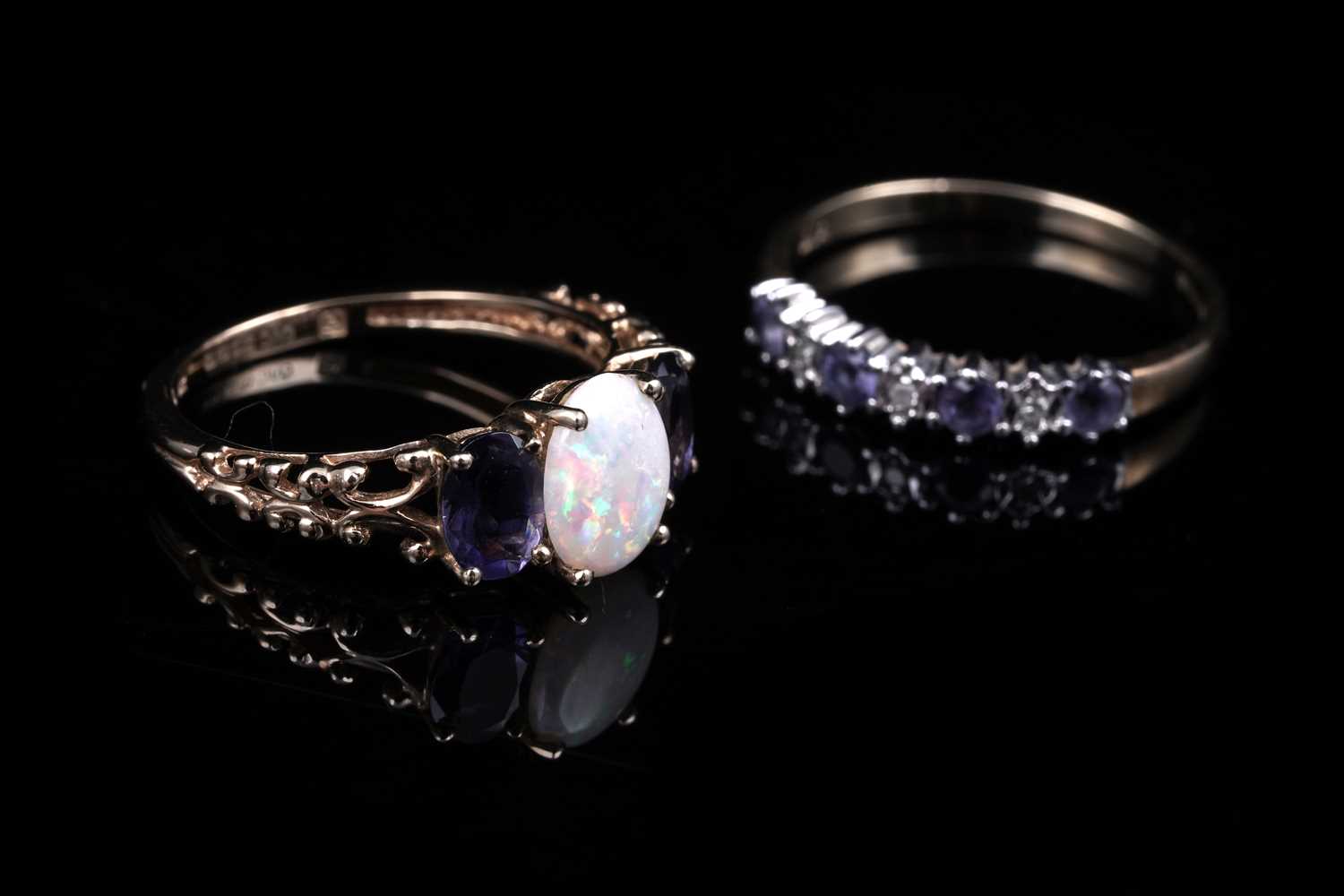 Lot 40 - An opal and tanzanite ring; and a tanzanite and diamond half hoop ring