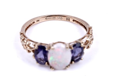Lot 40 - An opal and tanzanite ring; and a tanzanite and diamond half hoop ring