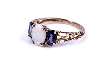 Lot 40 - An opal and tanzanite ring; and a tanzanite and diamond half hoop ring