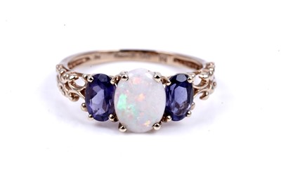 Lot 40 - An opal and tanzanite ring; and a tanzanite and diamond half hoop ring