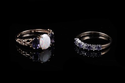 Lot 40 - An opal and tanzanite ring; and a tanzanite and diamond half hoop ring