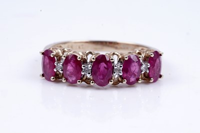 Lot 43 - A ruby and diamond half hoop eternity ring