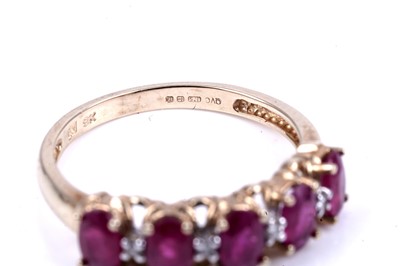 Lot 43 - A ruby and diamond half hoop eternity ring