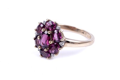 Lot 44 - A pink tourmaline and diamond cluster ring
