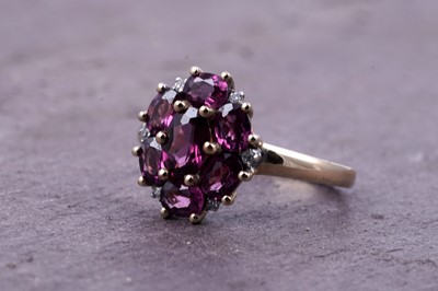 Lot 44 - A pink tourmaline and diamond cluster ring