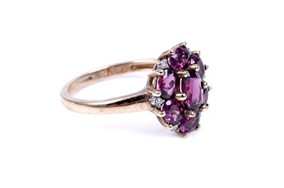 Lot 44 - A pink tourmaline and diamond cluster ring