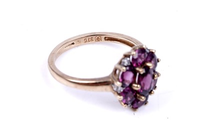 Lot 44 - A pink tourmaline and diamond cluster ring