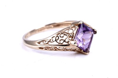 Lot 45 - An early 20th Century Art Deco green paste ring; and a purple spinel dress ring