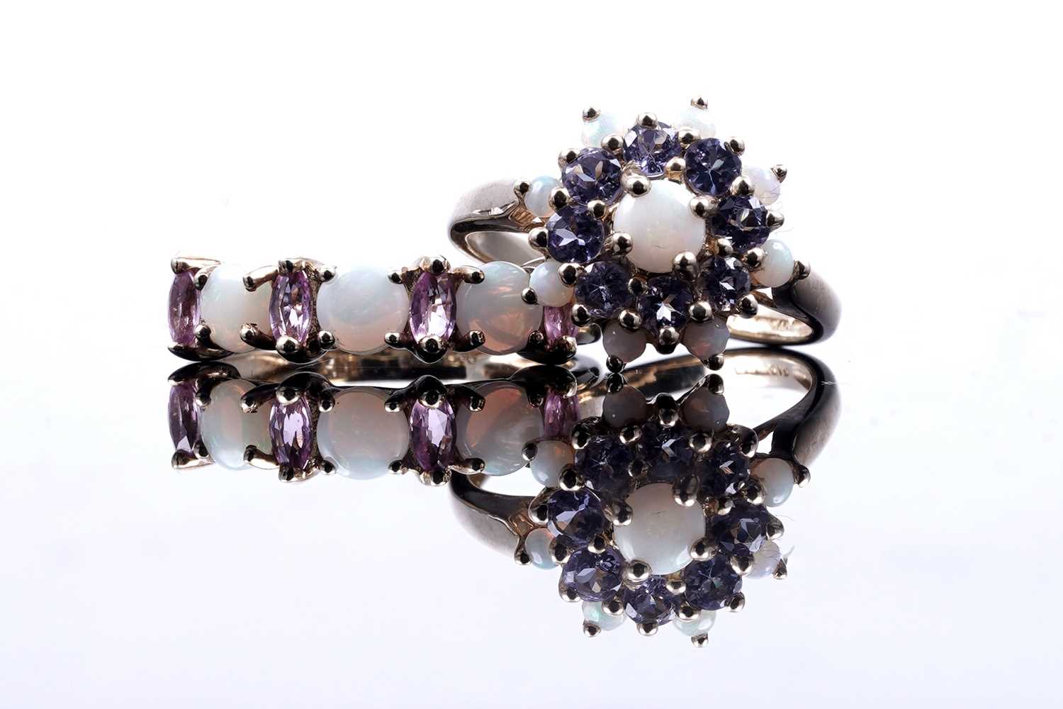 Lot 47 - A modern opal and pink sapphire half hoop eternity ring; and an opal and tanzanite cluster ring