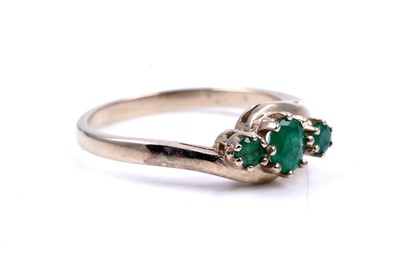Lot 48 - A contemporary three stone emerald ring