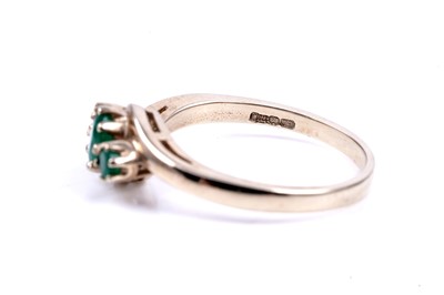 Lot 48 - A contemporary three stone emerald ring