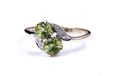 Lot 54 - A contemporary peridot pendant necklace and ring set