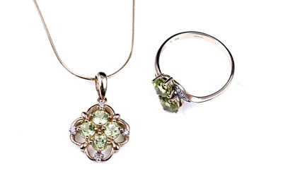 Lot 54 - A contemporary peridot pendant necklace and ring set