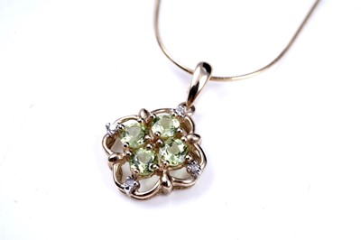 Lot 54 - A contemporary peridot pendant necklace and ring set