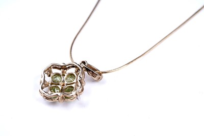 Lot 54 - A contemporary peridot pendant necklace and ring set