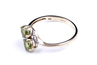Lot 54 - A contemporary peridot pendant necklace and ring set