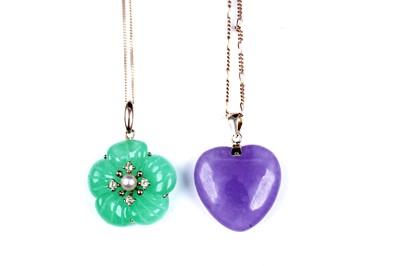 Lot 59 - A jade and yellow tourmaline flower pattern pendant; and a loveheart pendant on chain