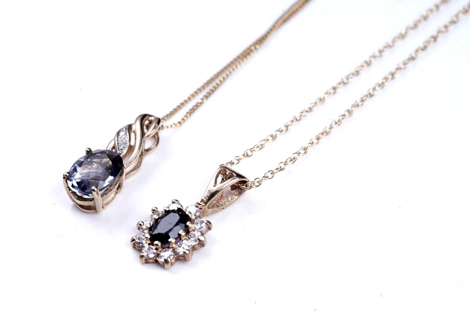 Lot 63 - A sapphire pendant necklace; and a topaz pendant necklace