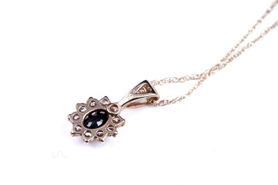 Lot 63 - A sapphire pendant necklace; and a topaz pendant necklace