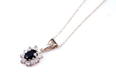 Lot 63 - A sapphire pendant necklace; and a topaz pendant necklace