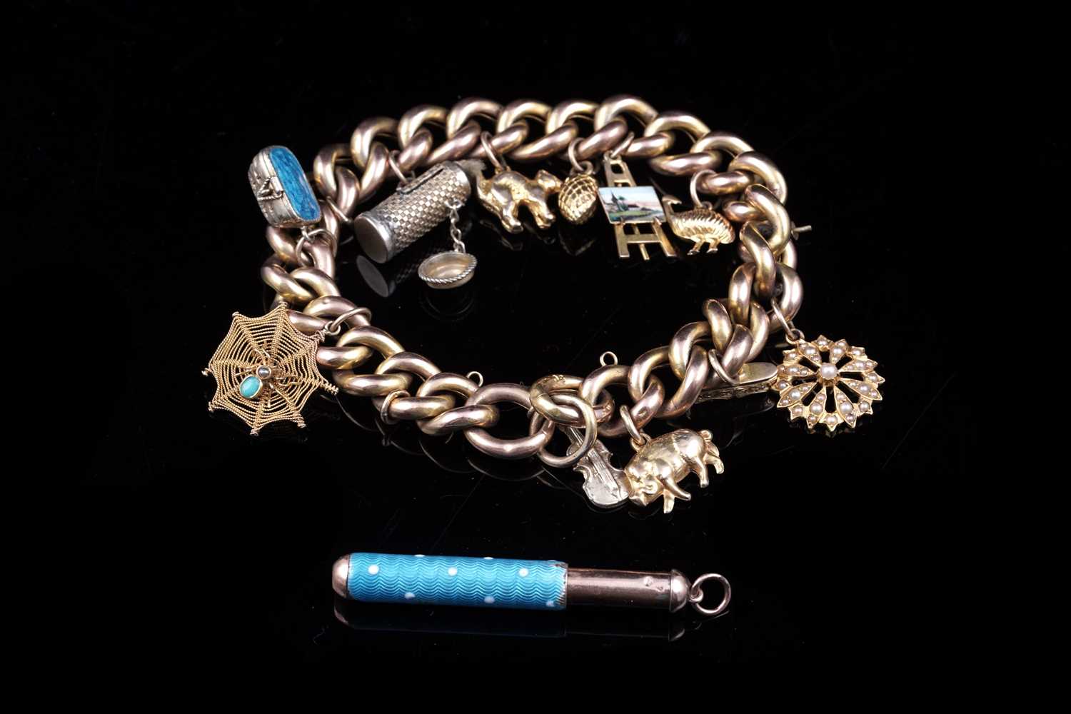 Lot 17 - An early 20th Century 9ct gold curb-link charm bracelet; and a 9ct rose gold fob propelling pencil
