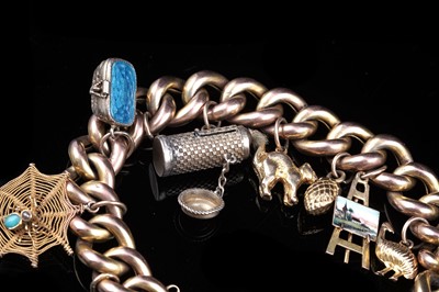 Lot 17 - An early 20th Century 9ct gold curb-link charm bracelet; and a 9ct rose gold fob propelling pencil