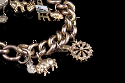 Lot 17 - An early 20th Century 9ct gold curb-link charm bracelet; and a 9ct rose gold fob propelling pencil