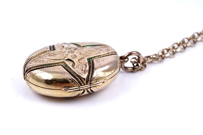 Lot 21 - A Victorian Gothic Revival locket on a 9ct gold fancy-link chain