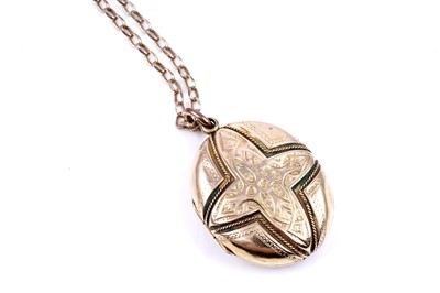 Lot 21 - A Victorian Gothic Revival locket on a 9ct gold fancy-link chain