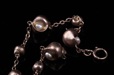 Lot 23 - An early 20th Century seashell pattern bracelet