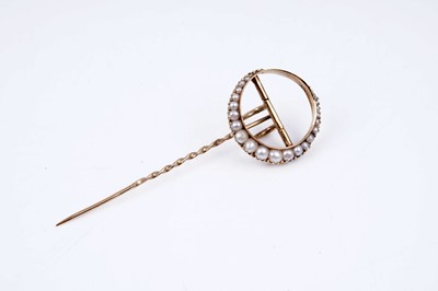 Lot 24 - An Edwardian crescent moon pattern stick pin set with seed pearls