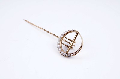 Lot 24 - An Edwardian crescent moon pattern stick pin set with seed pearls