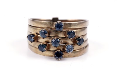 Lot 83 - A modern green and blue sapphire articulated ring