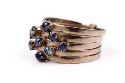 Lot 83 - A modern green and blue sapphire articulated ring