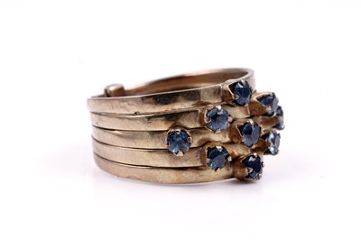 Lot 83 - A modern green and blue sapphire articulated ring