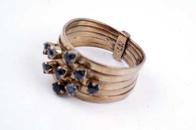 Lot 83 - A modern green and blue sapphire articulated ring