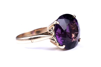 Lot 92 - A 20th Century amethyst dress ring
