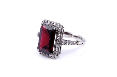 Lot 26 - An Art Deco style synthetic ruby and diamond dress ring