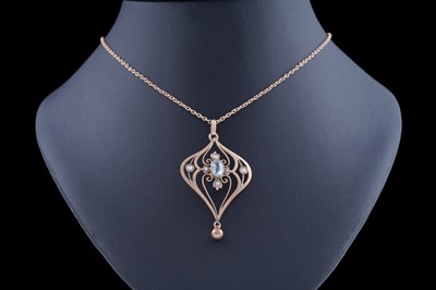Lot 438 - An Edwardian lady's Art Nouveau openwork pendant set with aquamarine and seed pearl